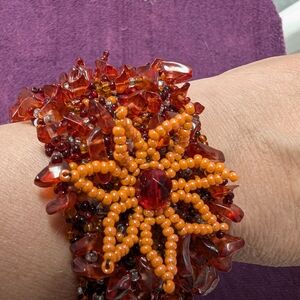 Elegant Beaded Bracelet with Red and Orange Accents